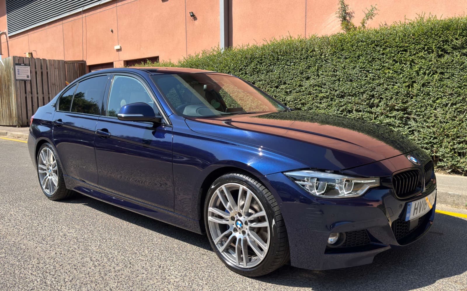 A blue BMW photographed for the R8 Motors vehicle inventory